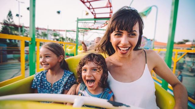 Mother and two children on rollercoaster